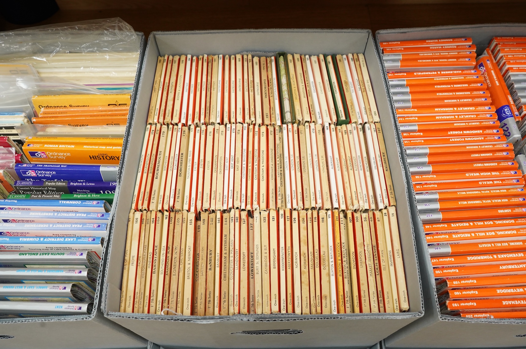 A collection of Ordnance Survey maps including Explorer series 1:25,000, Seventh Series One Inch, together with miscellaneous touring and historic editions (3 boxes)